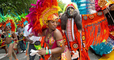 Tommy (right) and masqueraders from 2013 Large Band of the Year champions Ramajay playing mas on Eastern Parkway in the Labor Day Parade. |Sesame Flyers International, second place finisher in the Large Band of the Year competition, passing the Brooklyn Museum on Eastern Parkway, Labor Day.