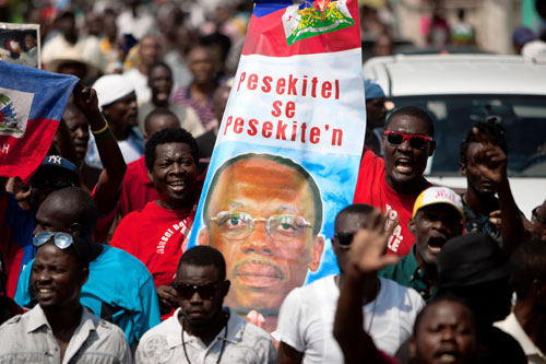 Loyalists, uncertainty surround Haiti’s ex-leader|Loyalists, uncertainty surround Haiti’s ex-leader