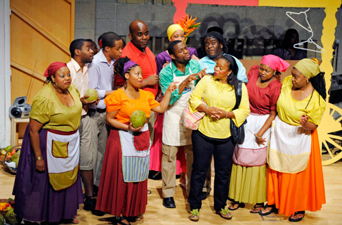 Actress Hillary Roosevelt Ricketts learning about the 'Breadfruit' from Braata Folk Singers members.