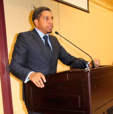 Vincentian Minister of Economic Planning Camillo Gonsalves addresses town hall meeting.|A section of the audience at the Vincentain town hall meeting.