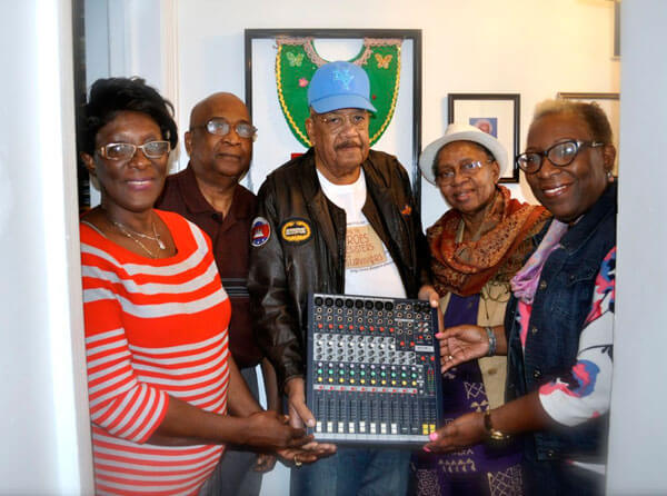 Guyanese playwright donates audio equipment to folk group