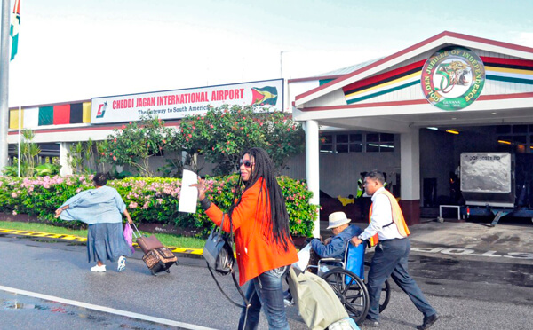 Passengers arriving at Cheddi Jagan International Airport in Guyana.