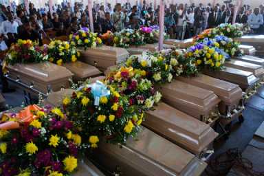 Mass funeral held for 20 Haitians who died in dismal prison|Mass funeral held for 20 Haitians who died in dismal prison
