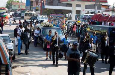 Grieving Haitians go into lifetime of debt to fund funerals|Grieving Haitians go into lifetime of debt to fund funerals