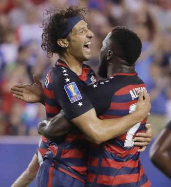 US survives bites, tops El Salvador 2-0 to advance