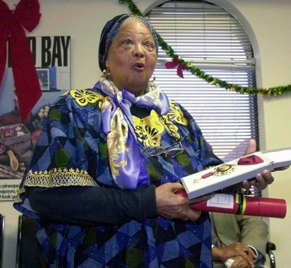 Louise Bennett-Coverley reacts as she is awarded the Order of Merit at the Jamaican Consulate in Toronto in this, Dec. 18; 2001 file photo.Bennett-Coverley died Wednesday, July 26, 2006. She was 86.