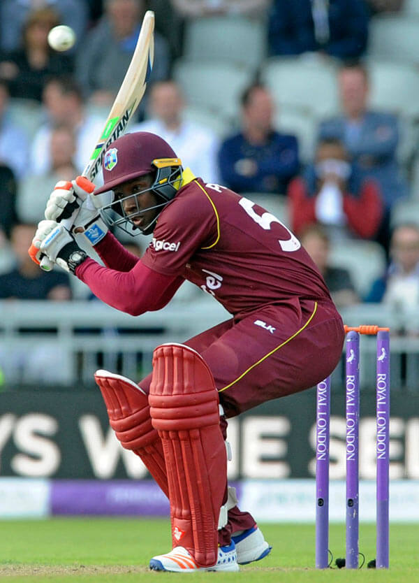West Indies defeats Ireland, leads group|West Indies defeats Ireland, leads group