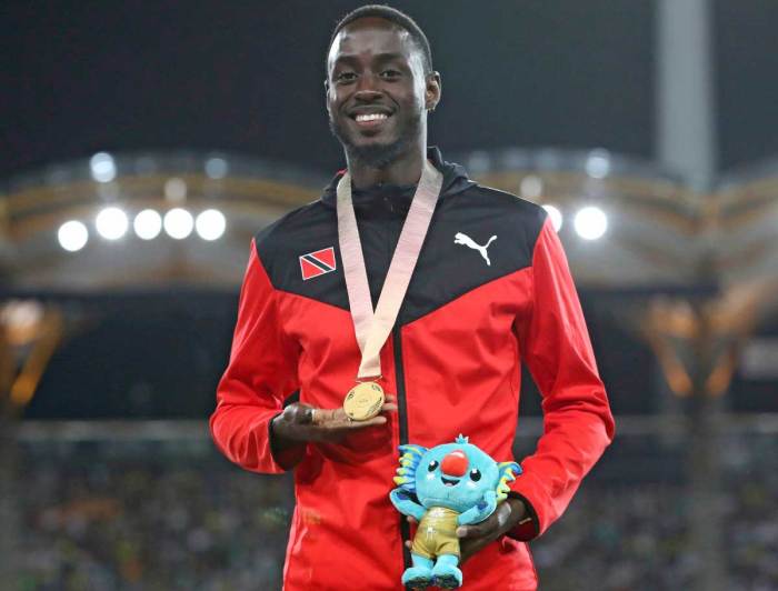 Men's 200m gold medalist Trinidad and Tobago's Jereem Richards on the podium at Carrara Stadium during the 2018 Commonwealth Games on the Gold Coast,Australia, Friday, April 13,2018.