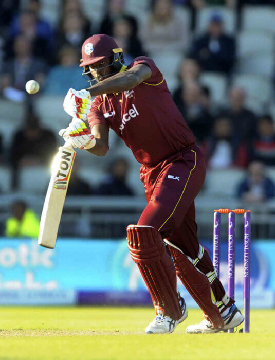 West Indies captain Jason Holder plays a shot during the first One-Day International cricket match between England and West Indies at Old Trafford in Manchester, England in 2017.