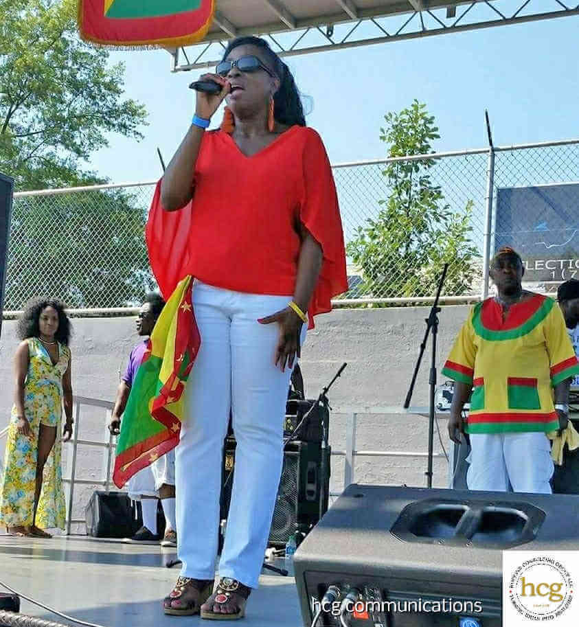 Grenadian recording artiste Cheryl Vincent delivering Grenada’s National Anthem at a past Grenada Day NYC.