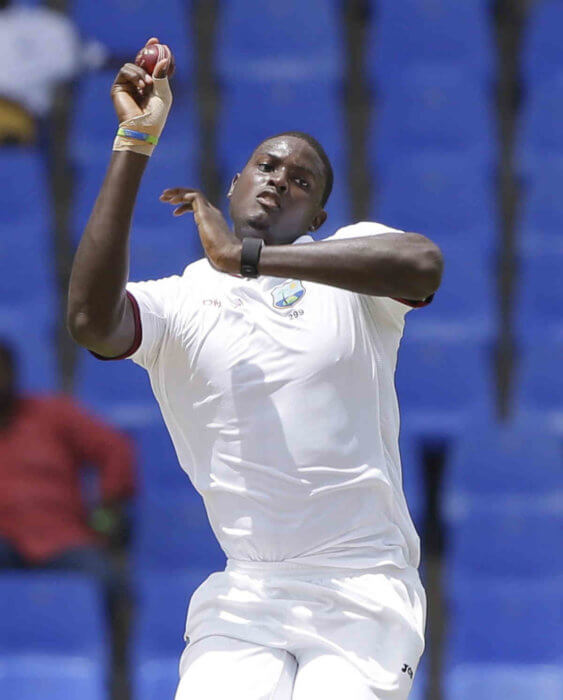 West Indies Captain Jason Holder bowls against India during day one of their first cricket Test match at the Sir Vivian Richards Stadium in North Sound, Antigua.