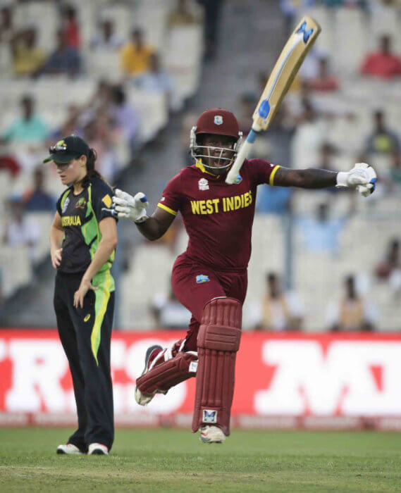 West Indies' Deandra Dottin throws the bat in delight as they win against Australia in the final of the ICC Women's World Twenty20 2016 cricket tournament at Eden Gardens in Kolkata, India, Sunday, April 3, 2016. 