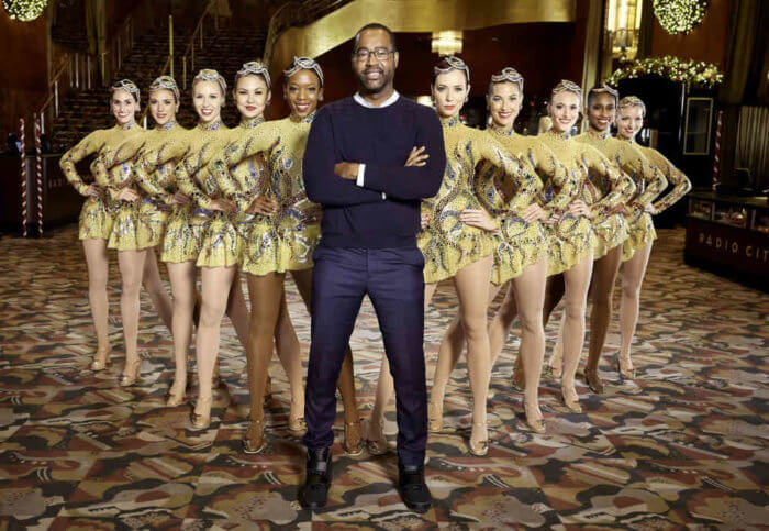 Costume designer Emilio Sosa pose with Rockettes in the new costume for the 2018 Radio City Christmas Spectacular.