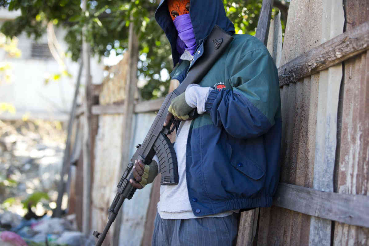 Witnesses: Men in police garb massacred civilians in Haiti