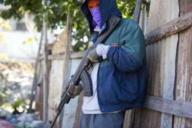 Witnesses: Men in police garb massacred civilians in Haiti