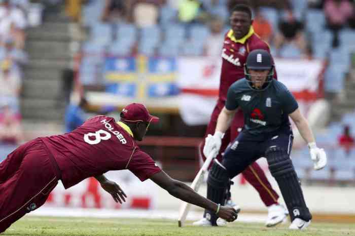 West Indies' Captain Jason Holder fields a shot from England's captain Eoin Morgan during the fifth One-Day International cricket match at the Daren Sammy Cricket Ground in Gros Islet, St. Lucia, Saturday, March 2, 2019.|