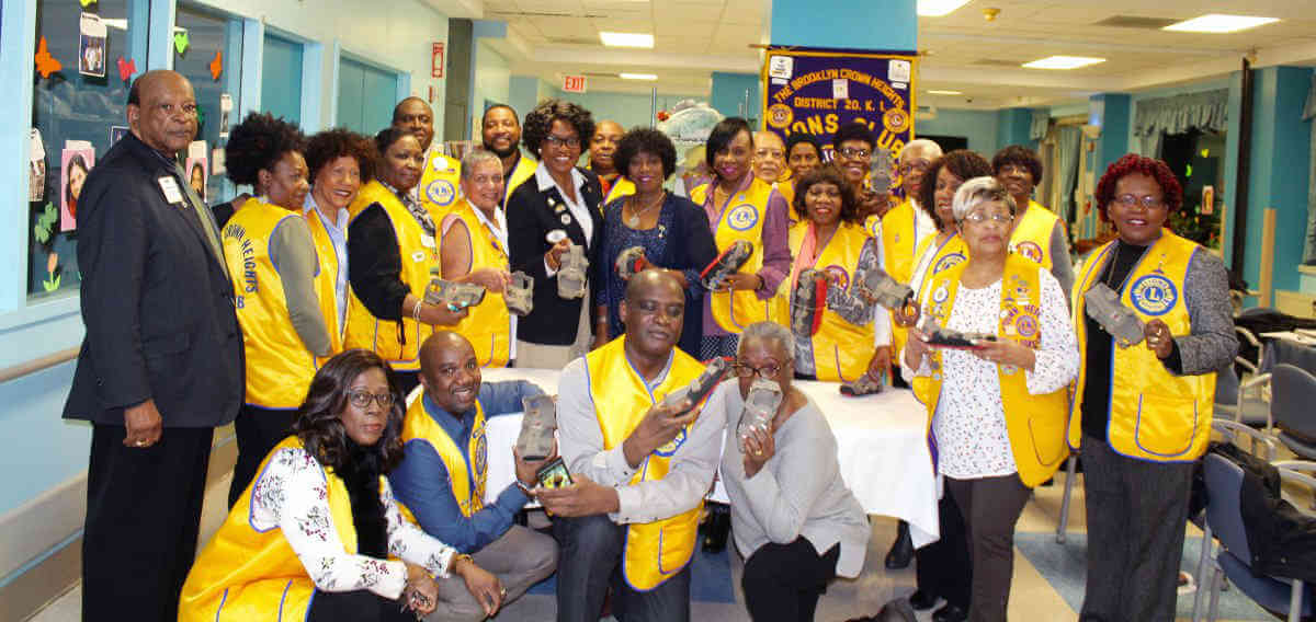 Crown Heights Lions Club donates 100 pairs of shoes to Guyana