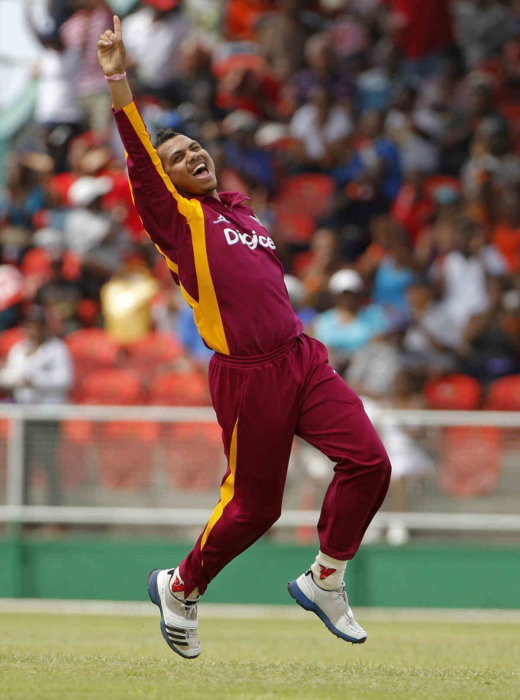 West Indies' Sunil Narine celebrates after bowling out Australia batsman for 2 runs during their third One-Day International cricket match in Kingstown, St. Vincent.