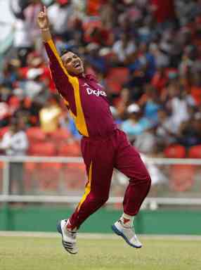 West Indies' Sunil Narine celebrates after bowling out Australia batsman for 2 runs during their third One-Day International cricket match in Kingstown, St. Vincent.
