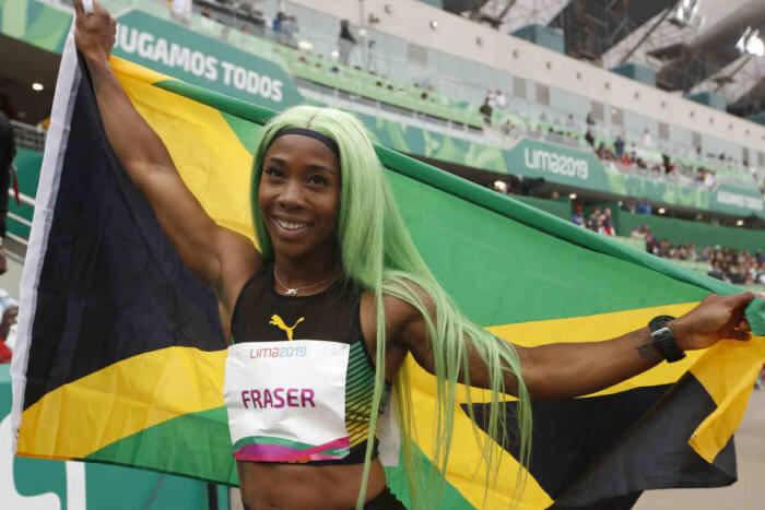 Shelly-Ann Fraser-Pryce of Jamaica celebrates winning the gold medal and setting and new Pan American record in the women’s 200m final during the athletics at the Pan American Games in Lima, Peru, Friday; Aug. 9, 2019.