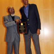 Moderator Jose Richards (left) presents plaque to Bob Law.
