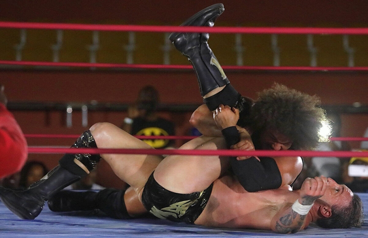 Carlito delights the crowd by pinning bad boy Masters.