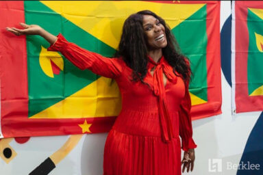 Yvette Noel-Schure with the Grenada flag.