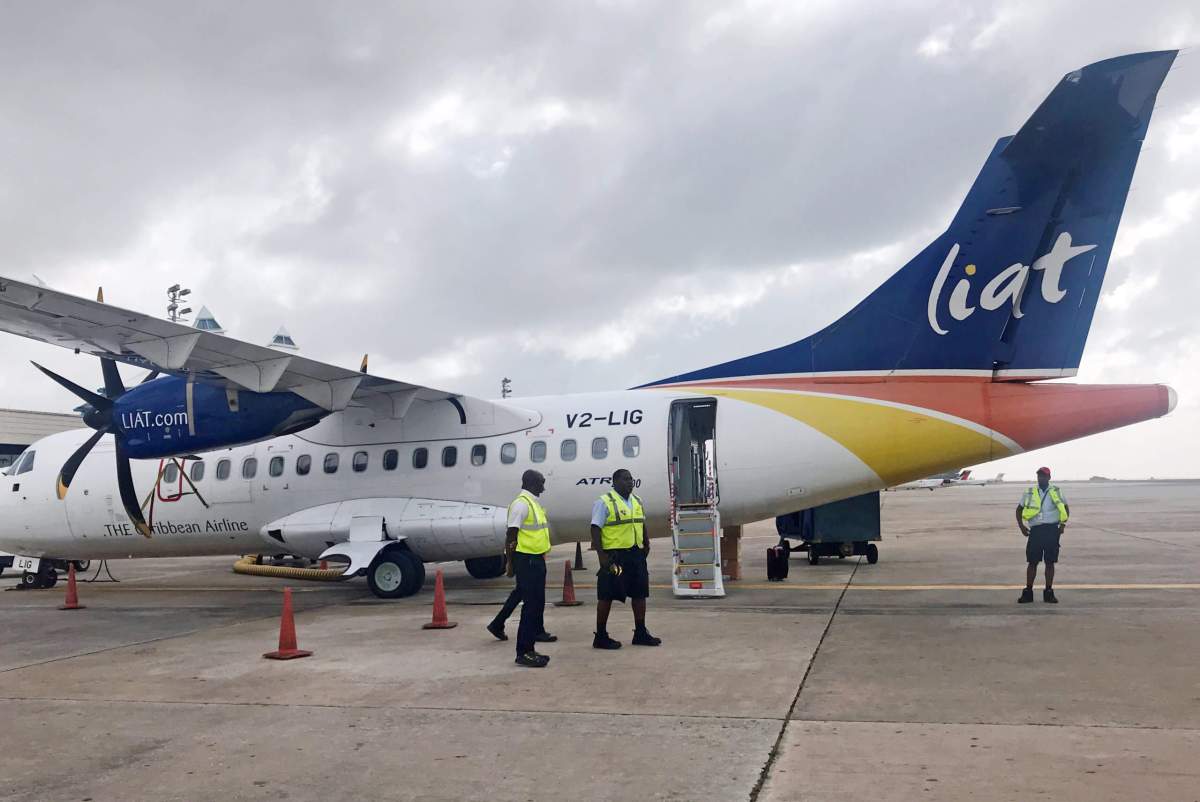 Groundcrew prepare a Liat airlines ATR 42 plane on the tarmac at Barbados’ Grantley Adams International Airport