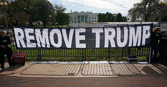 A ‘Remove Trump” banner outside the White House.  Jimbe Carroll