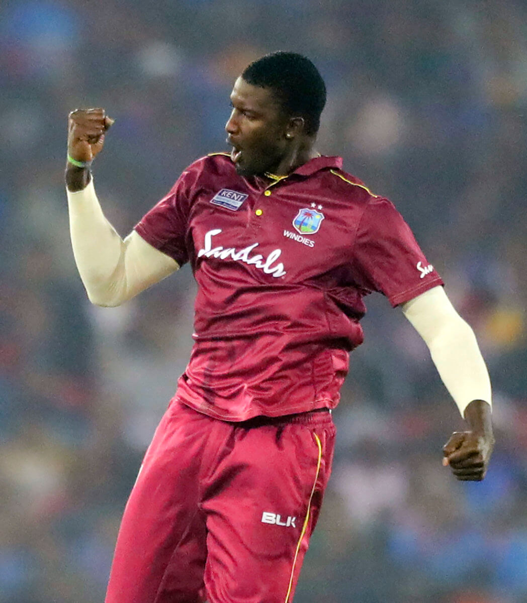 West Indies' Jason Holder celebrates the dismissal of India's Rohit Sharma during the third and final one-day international cricket match of the series between India and West Indies in Cuttack, India, Sunday, Dec. 22, 2019.