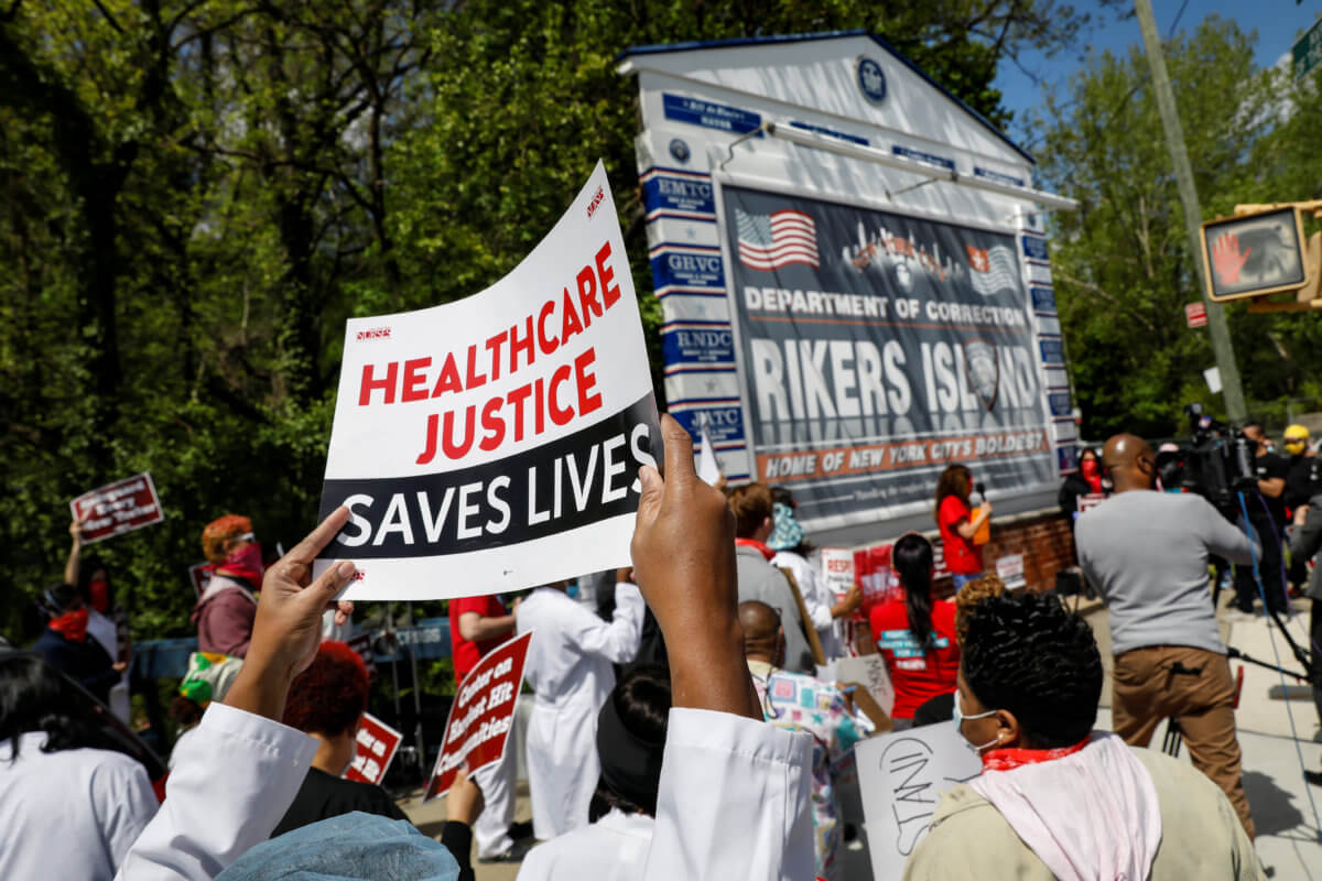 Nurses demonstrate outside Rikers Island Correctional facility in Queens, New York City