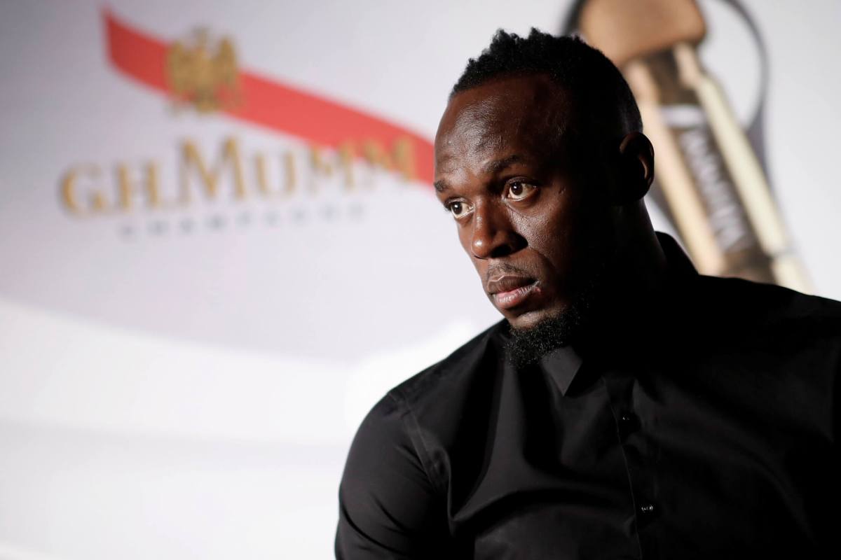 FILE PHOTO: Retired sprinter Usain Bolt attends a news conference after a zero gravity conditions flight in a specially modified plane above Reims