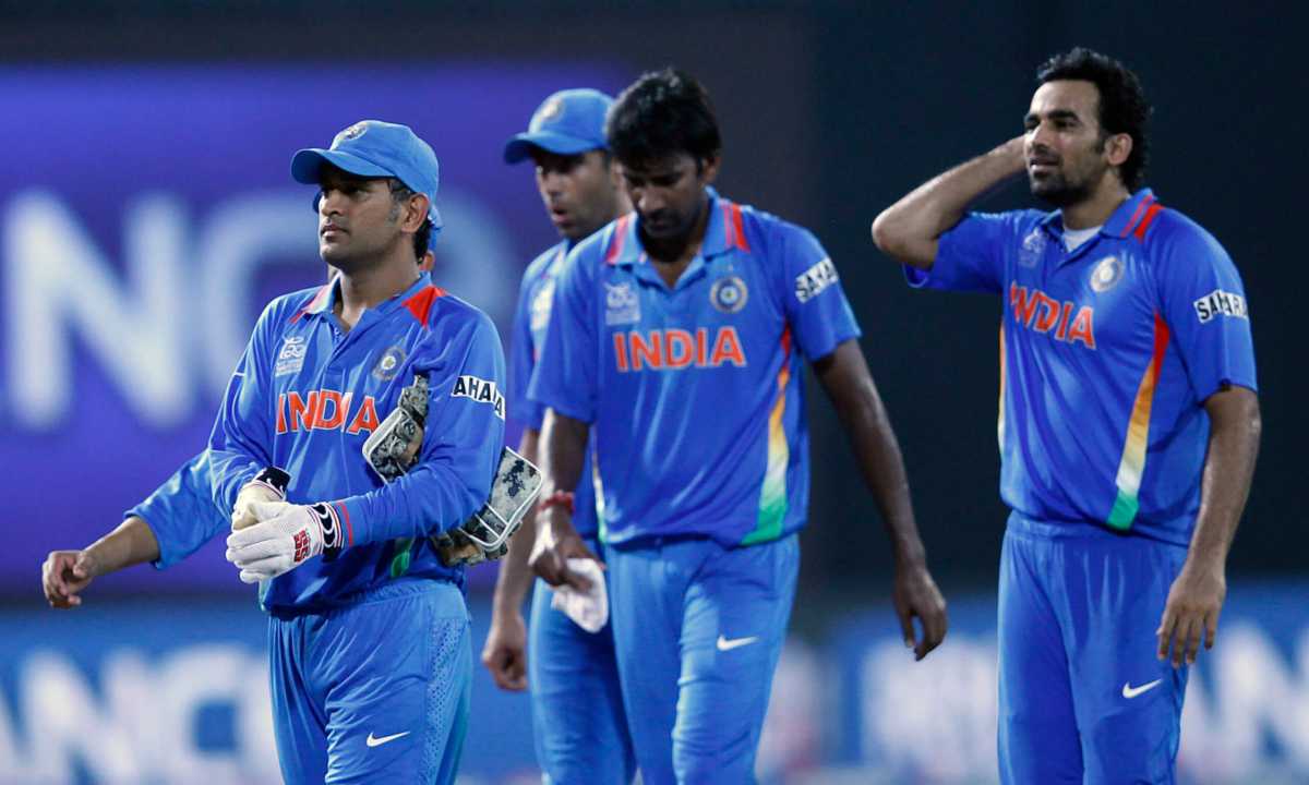 India’s captain Mahendra Singh Dhoni leads his men off the field after they won their Twenty20 World Cup Super 8 cricket match against South Africa in Colombo