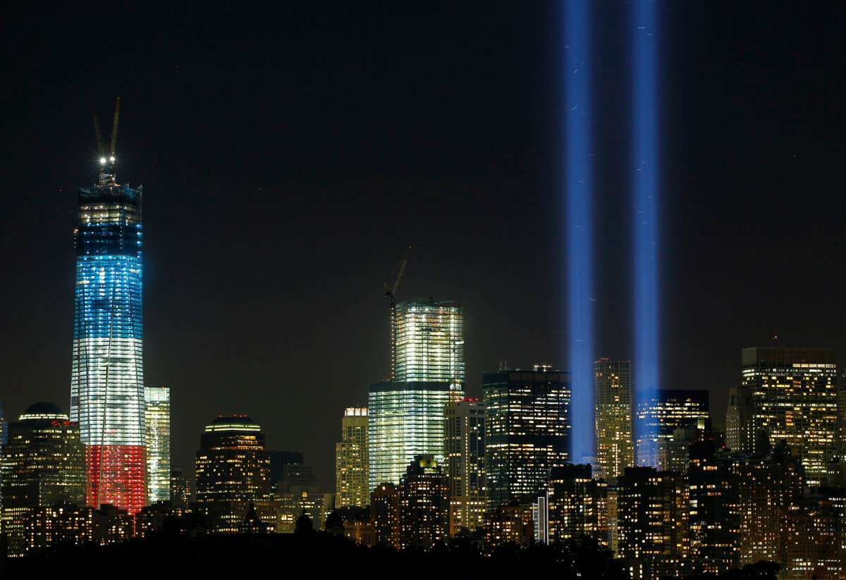 The Tribute in Light is illuminated next to One World Trade Center during events marking the 11th anniversary of the 9/11 attacks on the World Trade Center in New York