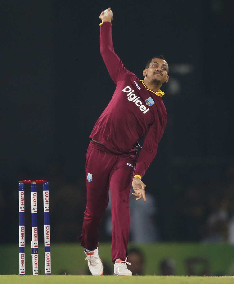 Narine bowls during their second Twenty 20 International cricket match against Sri Lanka in Colombo