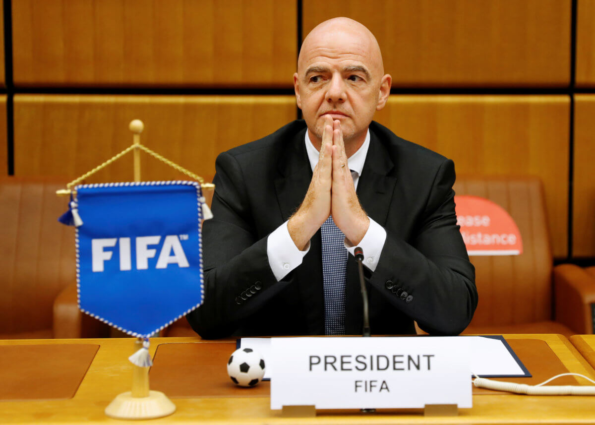 FIFA President Infantino waits for a signing ceremony in Vienna