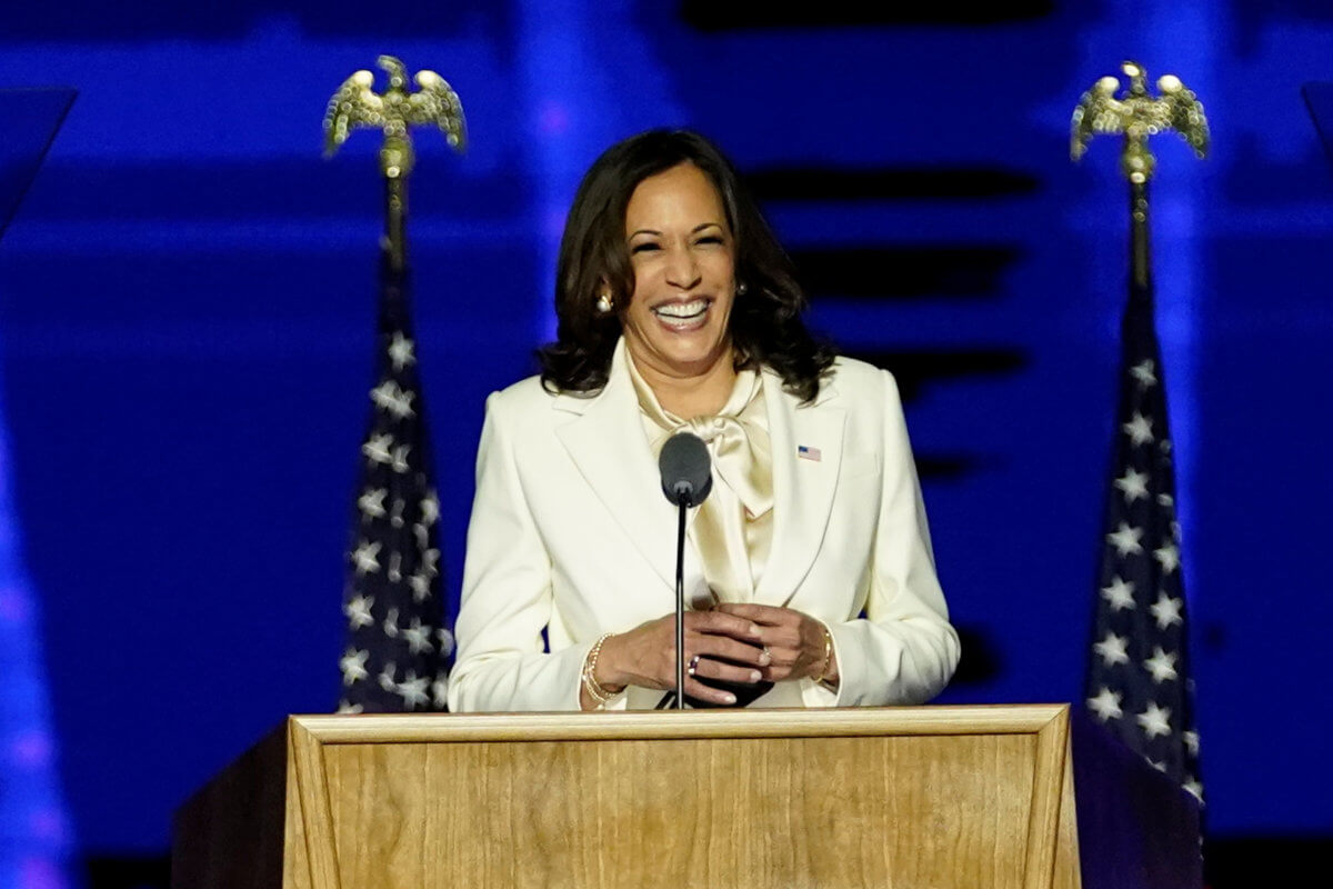 Democratic vice-presidential nominee Kamala Harris smiles as she speaks to supporters at a election rally, after news media announced that Biden has won the 2020 U.S. presidential election, in Wilmington