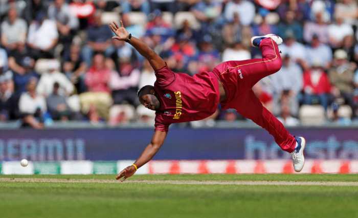 West Indies Andre Russell dives for the ball during the ICC Cricket World Cup match against England at the Ageas Bowl, Southampton, Britain on June 14, 2019.