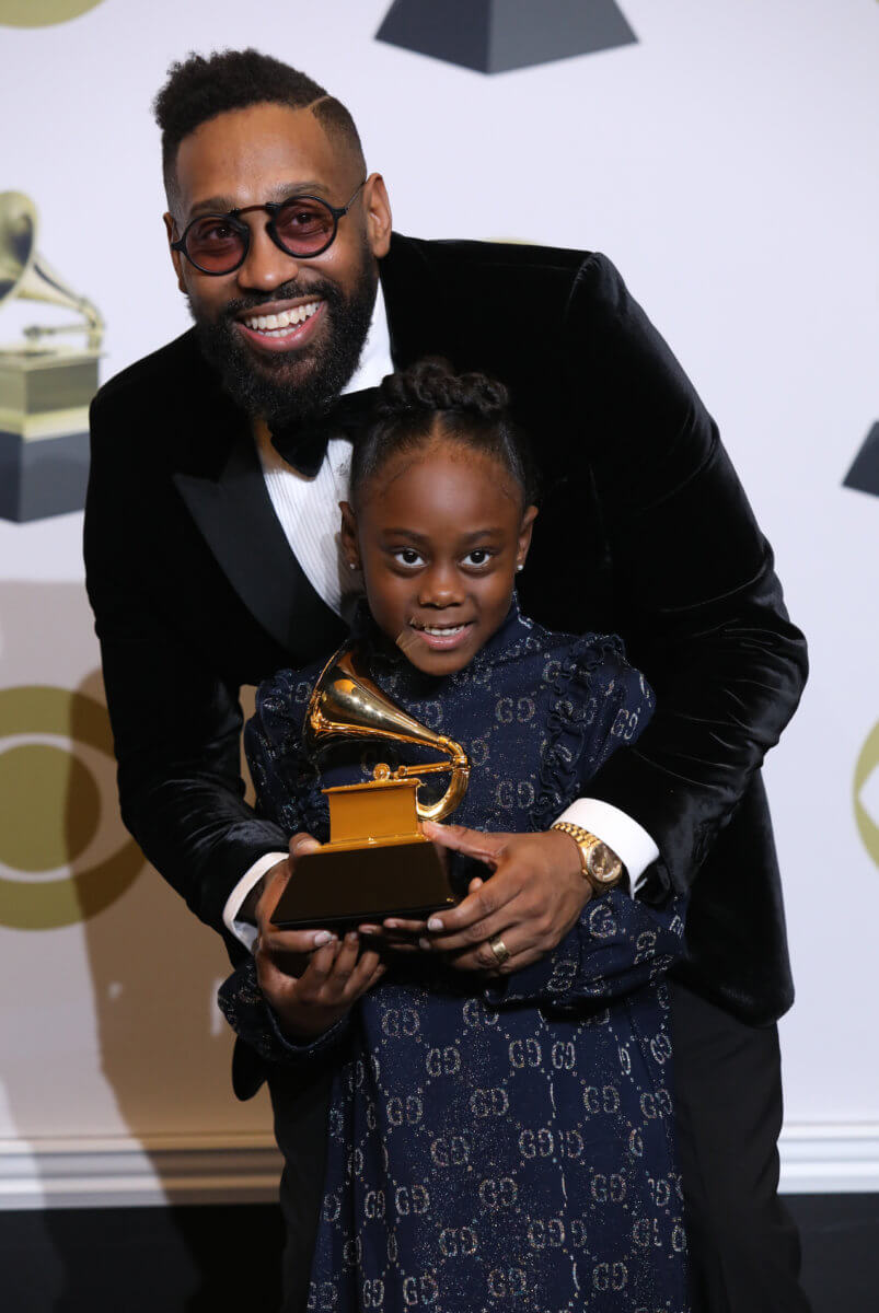 62nd Grammy Awards – Photo Room – Los Angeles, California, U.S., January 26, 2020 – PJ Morton with his daughter, Peyton, pose backstage with his Best R&B Song award for “Say So