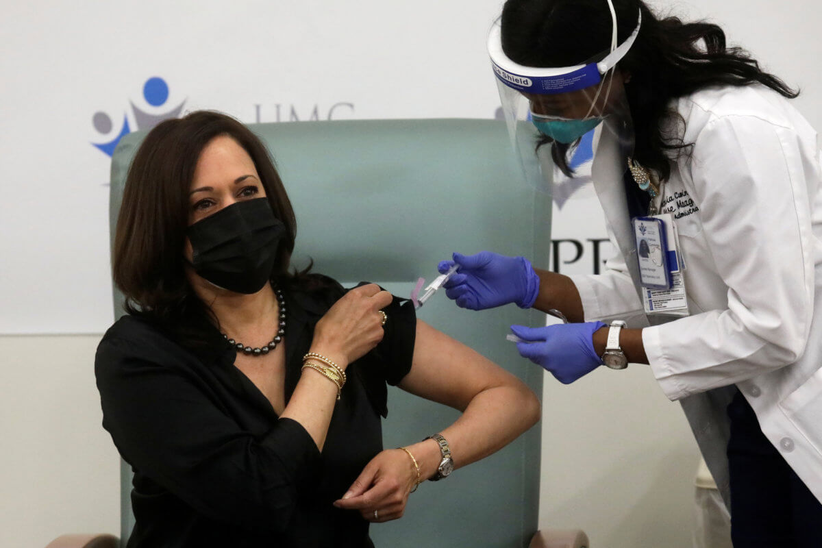 U.S. Vice President-elect Kamala Harris receives a dose of the Moderna COVID-19 vaccine in Washington