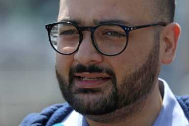 Immigration advocate Awawdeh speaks during a news conference to address the incoming travel ban to the U.S., at John F. Kennedy airport in the Queens borough of New York City