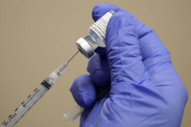 FILE PHOTO: A healthcare worker draws the coronavirus disease (COVID-19) vaccine from a vial at Dignity Health Glendale Memorial Hospital and Health Center in Glendale