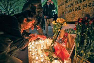 People take part in a vigil following the fatal police shooting of 20-year-old Black man Daunte Wright in Minnesota , in Washington