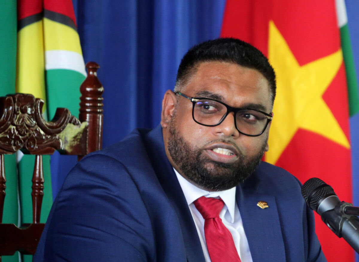 Guyana’s President Irfaan Ali addresses the media during a joint news conference with Suriname’s President Chandrikapersad Santokhi, a day before celebrations marking the 45th anniversary of Suriname’s independence, in Paramaribo