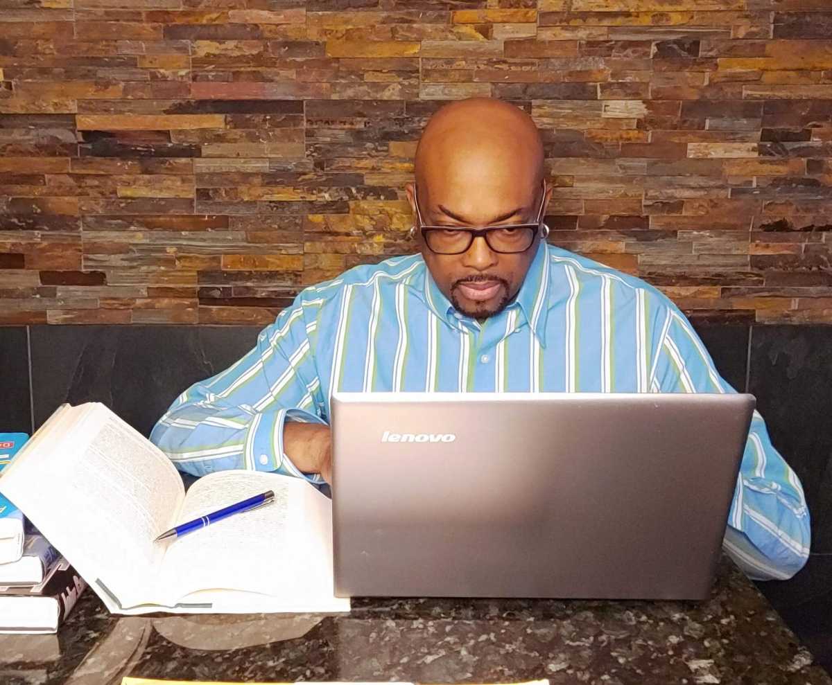 Anslem Douglas at work as a writer.  Anslem Douglas