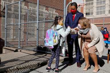 FILE PHOTO: Meisha Porter, Chancellor of the New York City Department of Education, greets students as they return to school in Manhattan, New York