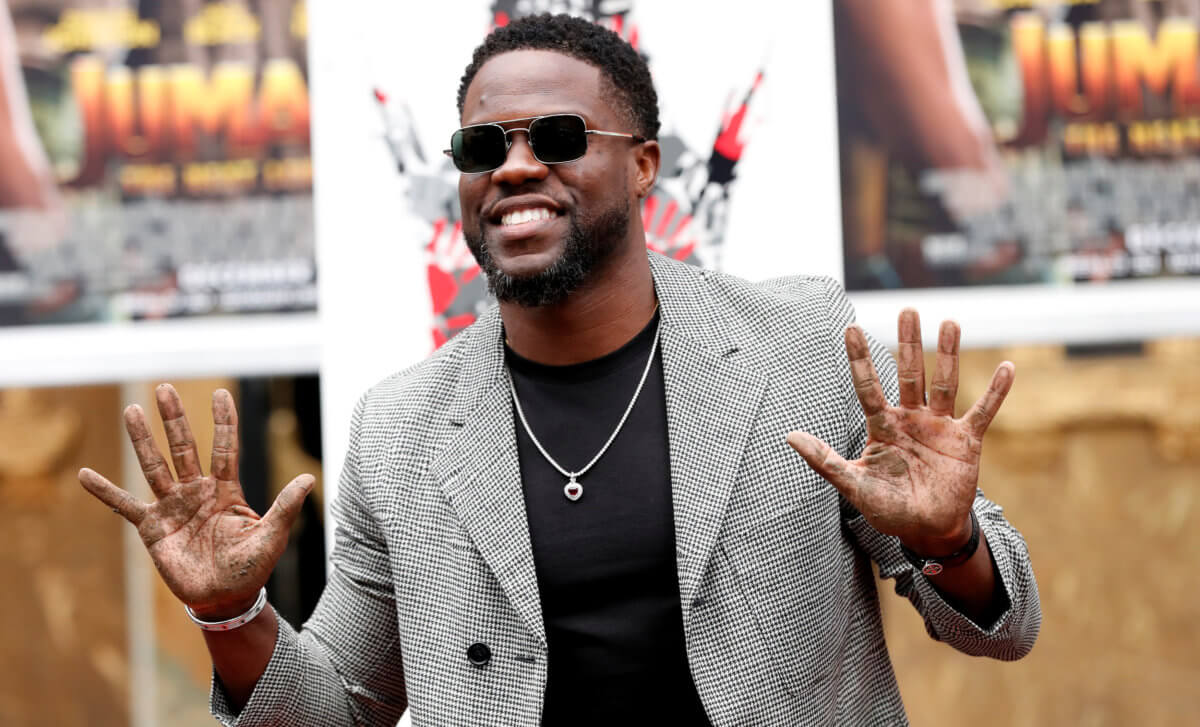 Actor Hart shows his hands after placing them in cement at a ceremony in the forecourt of the TCL Chinese theatre in Los Angeles