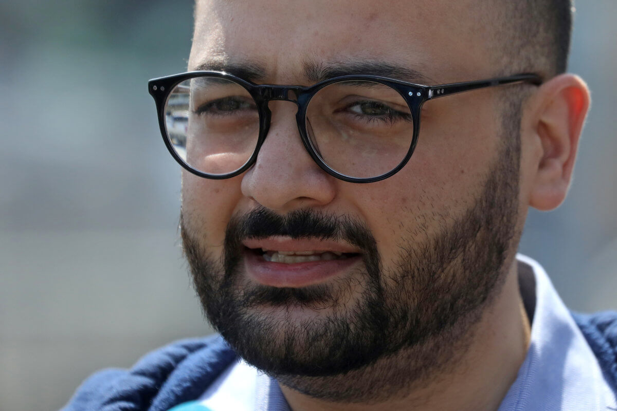 Immigration advocate Awawdeh speaks during a news conference to address the incoming travel ban to the U.S., at John F. Kennedy airport in the Queens borough of New York City