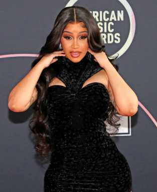 Show host Cardi B poses at a photo op ahead of the 49th Annual American Music Awards in Los Angeles