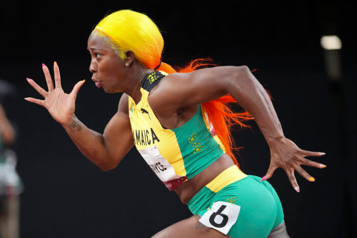 Shelly-Ann Fraser-Pryce, of Jamaica, competes in a women's 200-meter semifinal at the 2020 Summer Olympics, Monday, Aug. 2, 2021, in Tokyo.